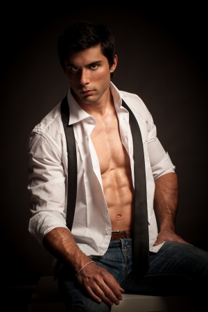 A handsome male model posing at a studio.の写真素材