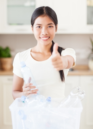 A young Asian woman who supports recycling.の写真素材