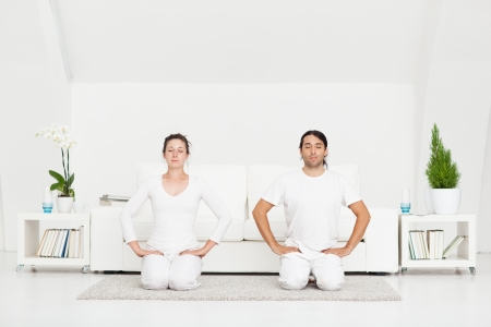 Couple in the Hero yoga position.の写真素材