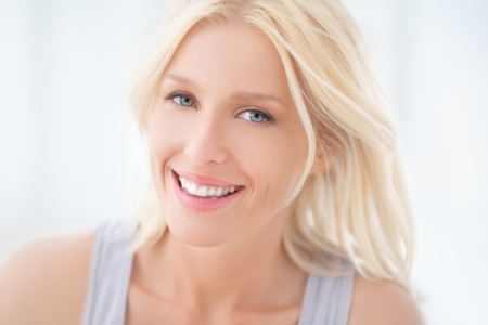 A portrait of a beautiful blonde woman smiling.の写真素材