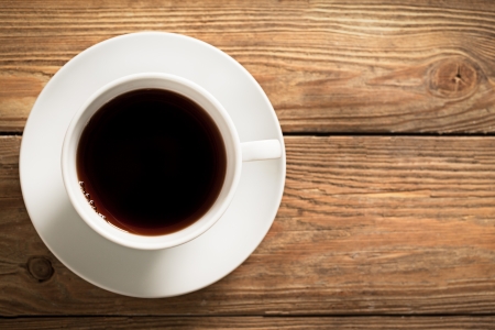 Cup of coffee on a wooden table.の写真素材