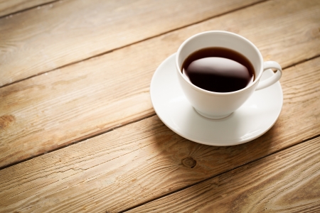 Cup of coffee on a wooden table.の写真素材
