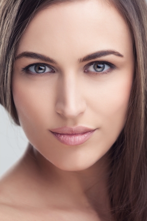 Portrait of a smiling young brunette.の写真素材