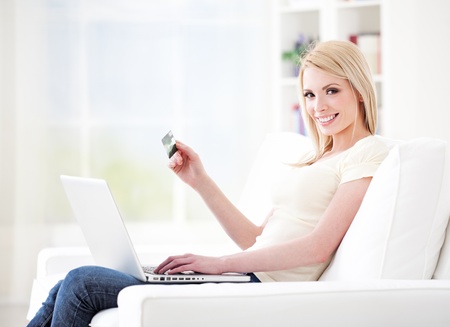 Beautiful young woman shopping online の写真素材