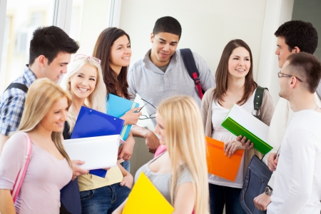 Students talking in the hallway.の写真素材