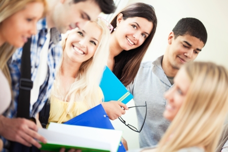 Group of smiling university students standing together.の写真素材