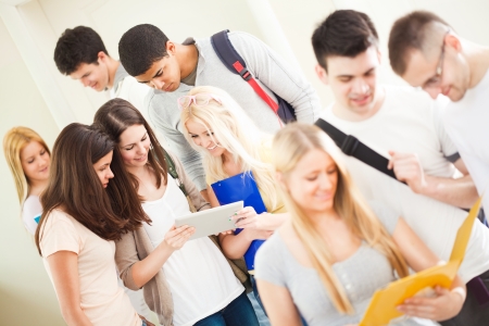 College students reading their notes together during the break.の写真素材