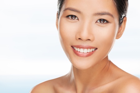 Portrait of a beautiful young Asian woman smiling.の写真素材