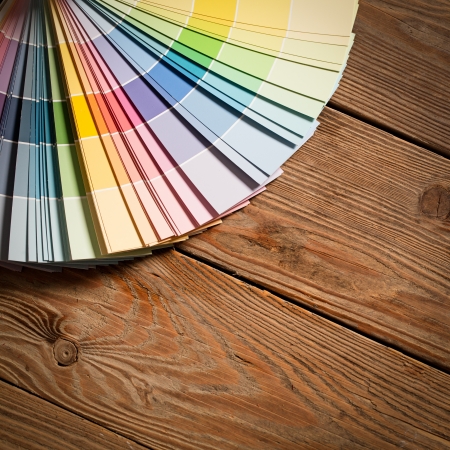 Paint colour palette on a wooden surface.の写真素材