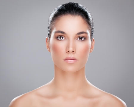 Sensual Caucasian woman posing against a gray background.の写真素材