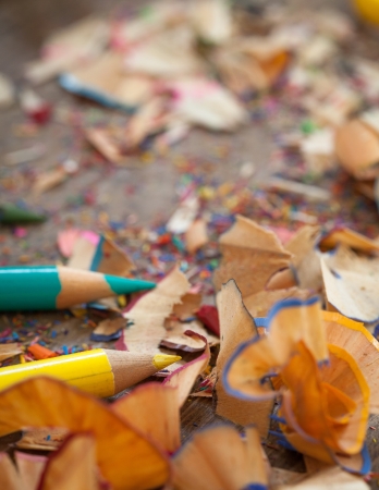 Sharpened colour pencils and pencil shavings in close-up.の写真素材