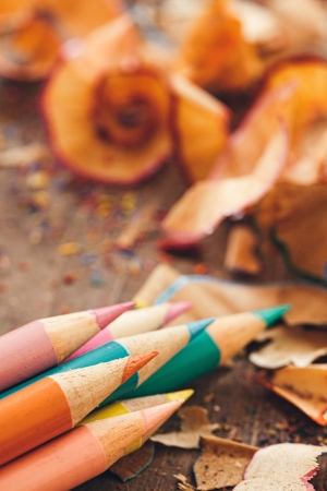 Sharpened colour pencils and pencil shavings in close-up.の写真素材