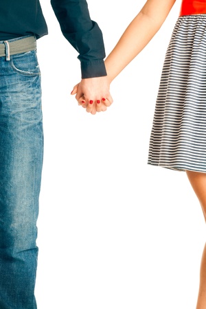 Couple in love holding hands. Isolated on white.の写真素材