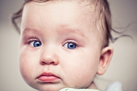 Close-up of an adorable blue-eyed baby boy 