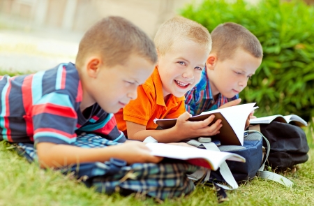 Three schoolboys studying together after school.の写真素材