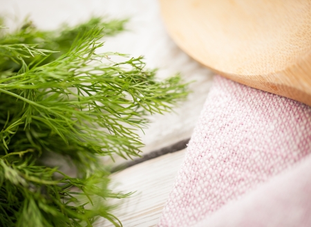 Fresh dill and a wooden scoop.の写真素材