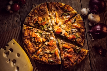 Delicious pizza on a wooden surface.の写真素材