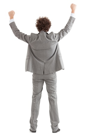 Back of a happy businessman raising his arms.の写真素材