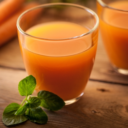 Glass of carrot juice in close-up.の写真素材