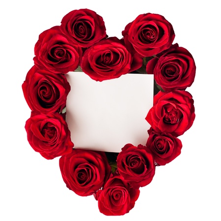 Valentine's Day card surrounded by red roses arranged in a heart shape.の写真素材