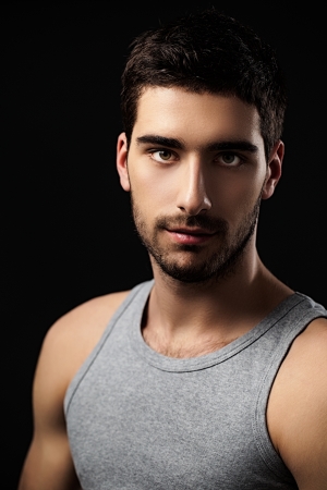 Portrait of a muscular young man wearing a sleeveless top.の写真素材