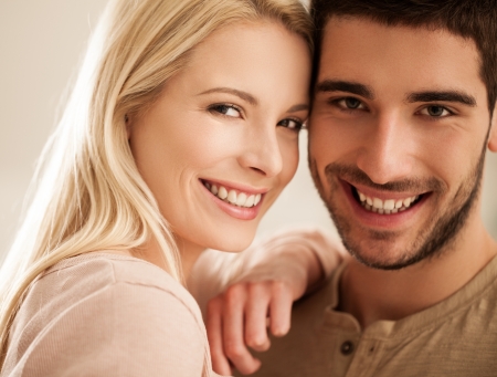 Smiling young couple posing together.の写真素材