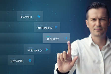 Safe ways for secure data network. Man pressing data security icon on virtual touch screen. Data security protection.の写真素材