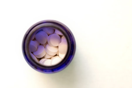 Medicines in pill bottle. Prescription drugs in blue bottle.の写真素材