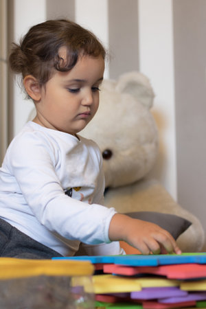 Small girl playing while spending a day at home.の写真素材