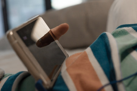 Close up of kid watching cartoons on smart phone.の写真素材