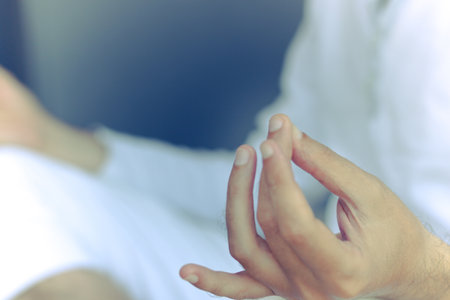 Close-up of man practicing Yoga in lotus position.の写真素材