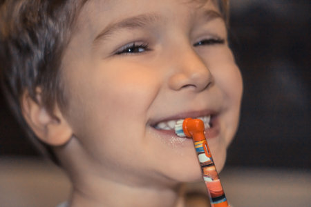 Close up of small boy brushing teeth in the morning.の写真素材