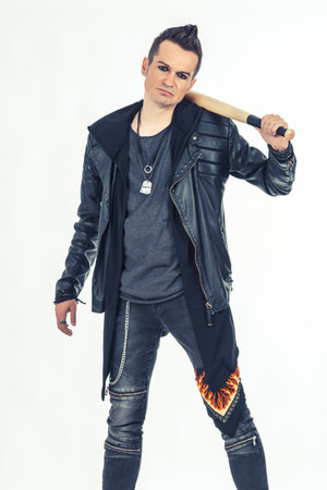 Portrait of a hooligan with baseball bat on white background.の写真素材