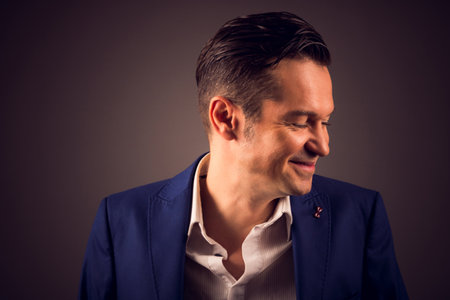 Portrait of well dressed smiling man.の写真素材