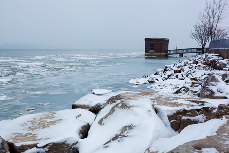 Detroit River Landscape view in winter with power generator buildingの写真素材