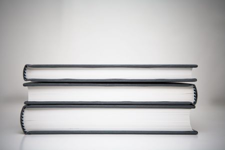 Books piled in abstract environmentの写真素材