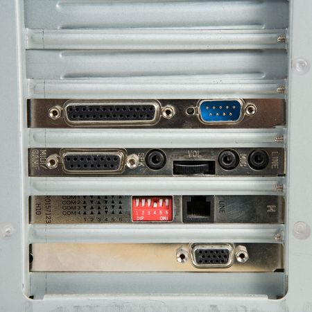 Card slots of a personal computer. Four cards installed, two slots free.の写真素材