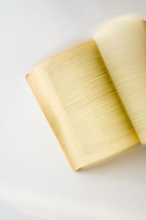 Old dictionary being browsed - motion blurの写真素材