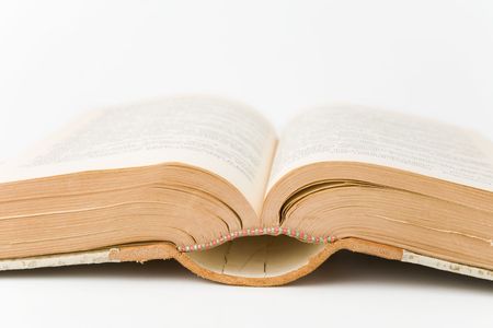 Old book open on a white backgroundの写真素材