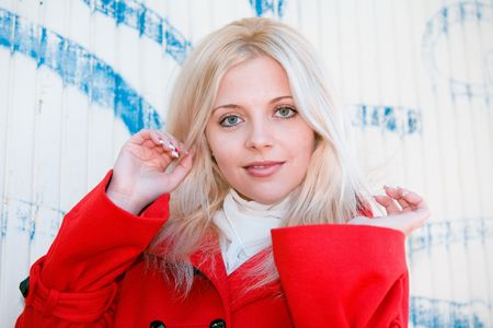 Portrait of young woman with wall in backgroundの写真素材