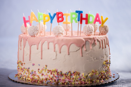 birthday,pink,cake,dessert,party,celebration,coconut,balls,kid,child,baloon,chocolate cupcakes,happy birthday,candlesの写真素材