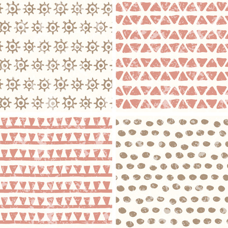 Set of 4 hand drawn geometric seamless patterns in primitive (tribal) style. Endless backdrop with tiangles, dots, archaic symbols of the sun. Soft colors (pink, brown) and a grunge texture.のイラスト素材