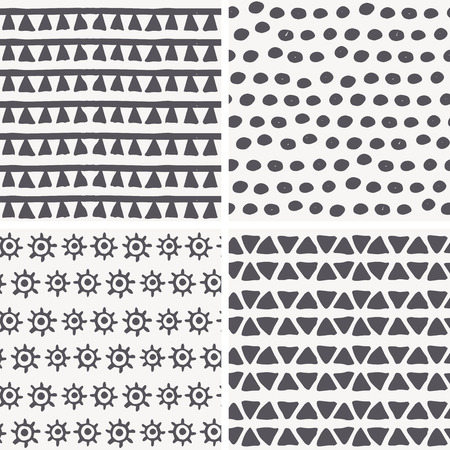 Set of 4 hand drawn geometric seamless patterns in primitive (tribal) style. Monochrome. Endless backdrop with tiangles, dots, archaic symbols of the sunのイラスト素材