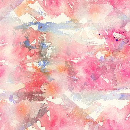 Abstract watercolor seamless pattern with splatter spots, drops and splashes. Light and soft tints of pink, red and tan. Hand-painted romantic texture for packaging, scrapbooking paper, fabricの写真素材
