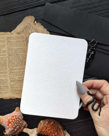 Stylish branding mockup to display your artworks. Blank sheet flat lay composition. Dark vintage art...