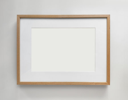 Wooden photo frame A4 size with White Photo Mat, horizontal artwork on a white wall, front view. High quality photoの写真素材