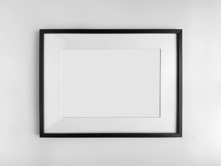 Black photo frame A4 size with White Photo Mat, horizontal artwork on a white wall, front view. High quality photoの写真素材