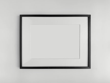 Black photo frame A4 size with White Photo Mat, horizontal artwork on a white wall, front view mockupの写真素材