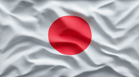 The Japanese flag waving with a prominent red circle on a white background, symbolizing national pride and identityの素材
