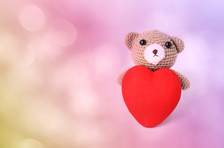 Romantic bears doll with red heart backgroundsの写真素材